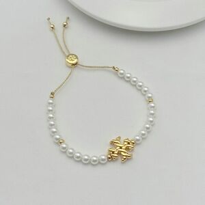 Tory Burch Elegant Gold and White Pearl Adjustable Bracelet